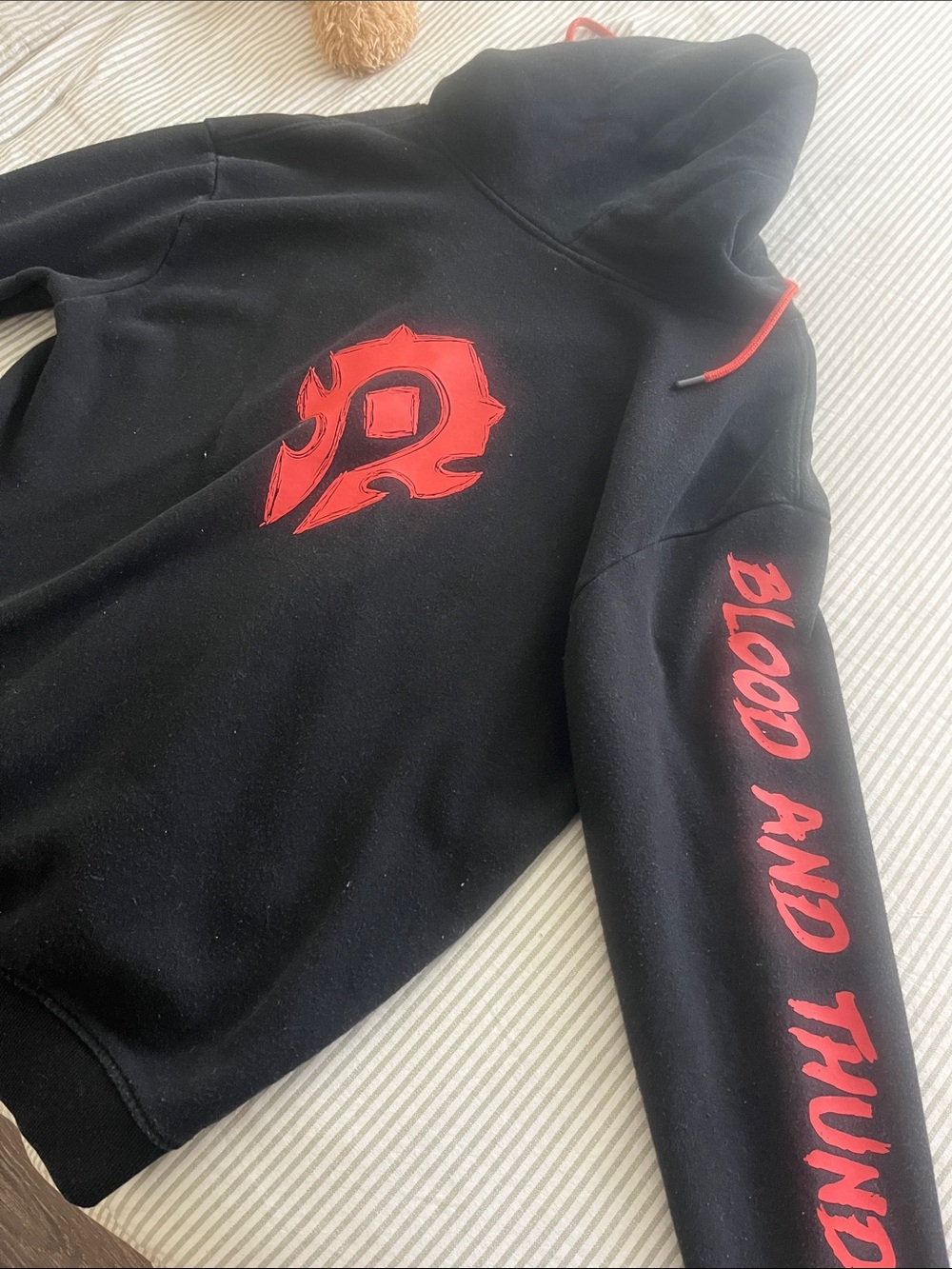 Black Zip-Up Hoodie with Red Logo and Drawstrings